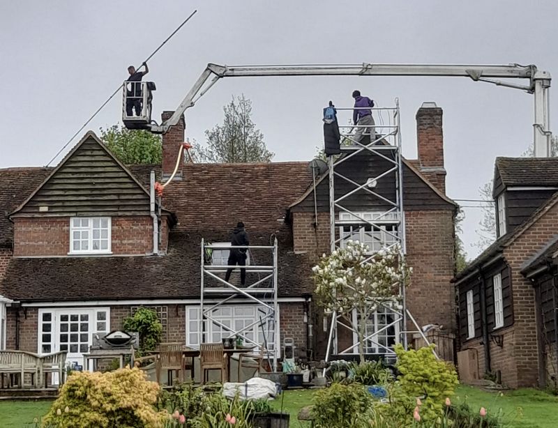 The Roof Moss Cleaners using cherry picker and scaffolding to clean roof safely and professionally in Datchet, Berkshire