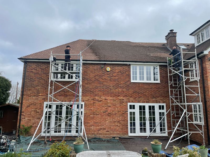 Roof cleaning carried out safely from scaffold towers by The Roof Moss Cleaners in Datchet